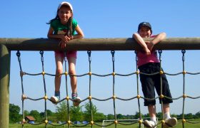 girls climbing on frame