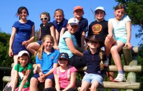 girls sitting on climbing frame